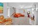 Comfortable living room with fireplace, staircase, hardwood floors, and an orange sectional sofa at 3358 North Ct, Ellenwood, GA 30294