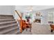 Cozy living room featuring a fireplace, television, staircase, and comfortable seating at 3358 North Ct, Ellenwood, GA 30294