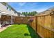 Spacious backyard featuring a well-maintained lawn, privacy fence, and a charming gazebo at 554 Rendevous Rd, Acworth, GA 30102
