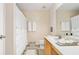 Bright bathroom featuring a shower with curtain, vanity with sink, and neutral decor at 554 Rendevous Rd, Acworth, GA 30102