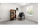 Home office in bedroom features a small desk and storage shelf with great natural light at 554 Rendevous Rd, Acworth, GA 30102