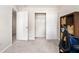 Neutral bedroom featuring sliding closet doors, and carpeted floors at 554 Rendevous Rd, Acworth, GA 30102