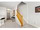 Welcoming foyer featuring neutral paint, plush carpet, wooden stairs, and ample natural light at 554 Rendevous Rd, Acworth, GA 30102