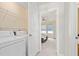 Convenient laundry area next to bedroom, with washer, dryer, and shelving at 554 Rendevous Rd, Acworth, GA 30102
