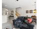 Open-concept living space with eat-in kitchen bar, dining area, and view of the staircase at 554 Rendevous Rd, Acworth, GA 30102