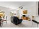 Open-concept living room with sliding door access to an outdoor seating area and backyard at 554 Rendevous Rd, Acworth, GA 30102