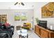 Comfortable living room with backyard views and outdoor seating visible through the sliding glass door at 554 Rendevous Rd, Acworth, GA 30102