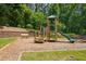 Fun playground with slide, climbing steps, benches, and wood mulch ground at 554 Rendevous Rd, Acworth, GA 30102