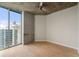 Bright bedroom featuring a large window offering a clear view of the city's skyline at 855 Peachtree Ne St # 3205, Atlanta, GA 30308