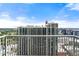 Stunning city view from a high-rise balcony with modern railings under a blue sky at 855 Peachtree Ne St # 3205, Atlanta, GA 30308