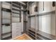 Walk-in closet featuring custom shelving and drawers for organized storage at 855 Peachtree Ne St # 3205, Atlanta, GA 30308