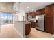 Modern kitchen with stainless steel appliances, granite countertops, and ample cabinet space overlooking balcony at 855 Peachtree Ne St # 3205, Atlanta, GA 30308