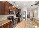 Modern kitchen features granite countertops, stainless steel appliances, and in-unit washer/dryer at 855 Peachtree Ne St # 3205, Atlanta, GA 30308