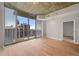 Modern living room with large windows offering a city view and stylish lighting fixtures at 855 Peachtree Ne St # 3205, Atlanta, GA 30308