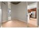 Open concept living area with hardwood floors, large windows and access to kitchen at 855 Peachtree Ne St # 3205, Atlanta, GA 30308