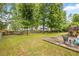 View of the backyard featuring a patio area and play area at 1839 Tranquil Field Nw Dr, Acworth, GA 30102