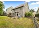 View of the backyard featuring a patio, playset, and lawn at 1839 Tranquil Field Nw Dr, Acworth, GA 30102