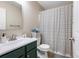 Well-lit bathroom features a mirror, a vanity, and a shower with a curtain at 1839 Tranquil Field Nw Dr, Acworth, GA 30102