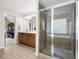 Bathroom featuring a tiled shower and a double sink vanity with a large mirror at 1839 Tranquil Field Nw Dr, Acworth, GA 30102