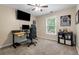 Comfortable bedroom features neutral walls, carpet, a ceiling fan, and a window with blinds at 1839 Tranquil Field Nw Dr, Acworth, GA 30102