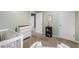 Spacious bedroom features a changing table, a crib, and access to another room at 1839 Tranquil Field Nw Dr, Acworth, GA 30102