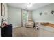 Well-lit bedroom with neutral walls, a ceiling fan, and a window with blinds at 1839 Tranquil Field Nw Dr, Acworth, GA 30102
