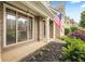Inviting front porch with an American flag at 1839 Tranquil Field Nw Dr, Acworth, GA 30102