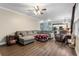 Open concept living room flows into kitchen with hardwood floors and neutral tones at 1839 Tranquil Field Nw Dr, Acworth, GA 30102