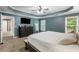 Primary bedroom featuring a tray ceiling, a large window and an ensuite bathroom at 1839 Tranquil Field Nw Dr, Acworth, GA 30102