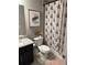 Bright bathroom featuring an Eiffel Tower shower curtain and granite vanity top at 2709 Ratby Ne Ln, Conyers, GA 30013