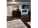 Bedroom features fireplace, TV, and dresser with mirror creating a cozy retreat at 2709 Ratby Ne Ln, Conyers, GA 30013