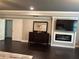 Bedroom features fireplace, TV, and dresser with mirror creating a cozy retreat at 2709 Ratby Ne Ln, Conyers, GA 30013