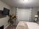 Cozy bedroom featuring modern TV and unique decor at 2709 Ratby Ne Ln, Conyers, GA 30013