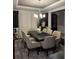 Elegant dining room featuring a modern chandelier, large table with seating for eight, and sophisticated decor at 2709 Ratby Ne Ln, Conyers, GA 30013