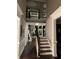 Stunning foyer showcasing high ceilings, a staircase with dark wood accents, and an open view to the upper level at 2709 Ratby Ne Ln, Conyers, GA 30013