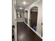 Upstairs hallway featuring hardwood flooring and modern decor at 2709 Ratby Ne Ln, Conyers, GA 30013