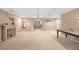Finished basement with fireplace, table, and neutral carpet at 3310 Vista Creek Dr, Dacula, GA 30019