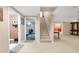 Open basement with carpeted floors and stairs leading to the upper level; neutral paint at 3310 Vista Creek Dr, Dacula, GA 30019