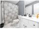 Modern bathroom with white vanity, patterned shower curtain, and neutral gray walls at 3310 Vista Creek Dr, Dacula, GA 30019