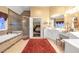 Well-lit bathroom featuring a jetted tub, a glass shower, and dual vanities at 3310 Vista Creek Dr, Dacula, GA 30019