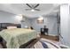 Bedroom in basement has a black bed frame and a mounted TV; light gray walls at 3310 Vista Creek Dr, Dacula, GA 30019