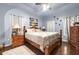 Comfortable bedroom featuring hardwood floors, a ceiling fan, and unique decorative accents at 3310 Vista Creek Dr, Dacula, GA 30019