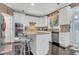 Well-lit kitchen with island, stainless steel appliances, granite counters and white cabinetry at 3310 Vista Creek Dr, Dacula, GA 30019