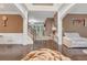 Open-concept living room with dark wood floors, neutral decor, and an elegant staircase at 3310 Vista Creek Dr, Dacula, GA 30019