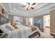 Spacious main bedroom featuring tray ceiling and a large aquarium at 3310 Vista Creek Dr, Dacula, GA 30019