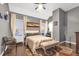 This main bedroom features neutral walls and a high ceiling with ceiling fan for added comfort at 3310 Vista Creek Dr, Dacula, GA 30019