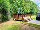 Private backyard deck overlooking lush greenery, offering ample space for outdoor relaxation and entertainment with room for a grill at 5848 Rex Ridge Loop, Rex, GA 30273