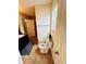 Well-lit bathroom with a vanity, tiled floors, and neutral decor at 5848 Rex Ridge Loop, Rex, GA 30273