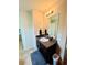 Clean bathroom featuring vanity with granite countertop and an ample mirror at 5848 Rex Ridge Loop, Rex, GA 30273