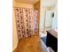 Bathroom featuring a shower/tub combo with a leaf-patterned shower curtain at 5848 Rex Ridge Loop, Rex, GA 30273